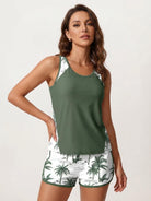 Racerback two-piece tankini set with relaxed fit tank and tropical print swim shorts with pockets and drawstring waistband