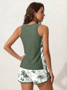 Racerback two-piece tankini set with scoop neckline and tropical print swim shorts