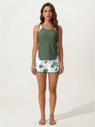 Racerback two-piece tankini set with scoop neckline and tropical print swim shorts featuring pockets and drawstring waistband