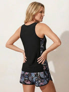 Racerback two-piece tankini set with scoop neckline and tropical print swim shorts featuring pockets and drawstring waistband