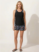 Racerback two-piece tankini set with hip-length tank top and tropical print swim shorts with side pockets and built-in lining