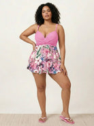 Tropical crossover skirted one-piece swimsuit with deep-V solid top and floral high-waist skirted bottom