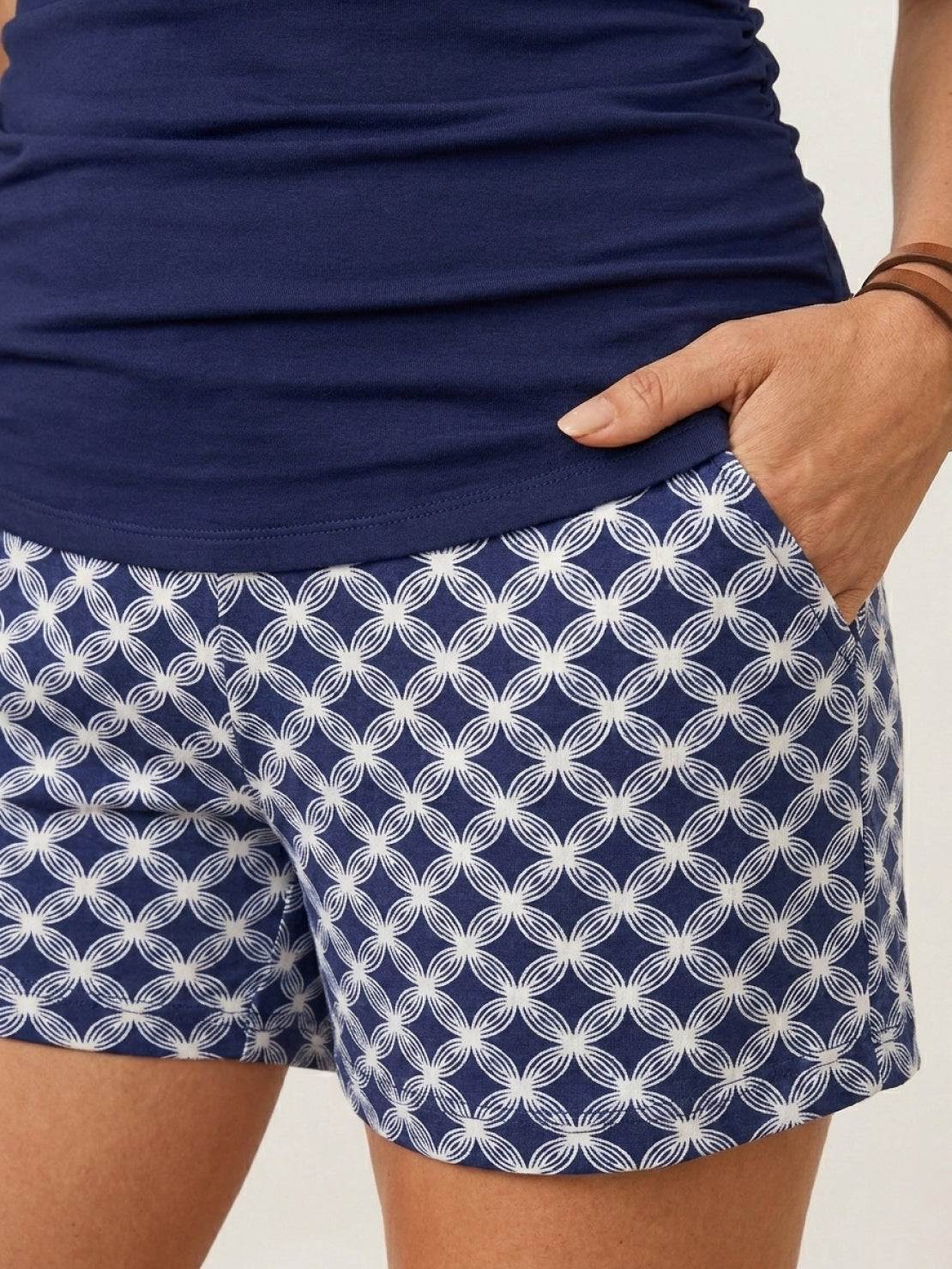 High-neck ruched tankini set with gathered side seams and built-in brief, ideal for swimming and beachwear.