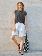 White 100% linen belted shorts with high-rise waist and relaxed wide-leg fit