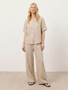 100% cotton navy blue two-piece set with button-front shirt and wide-leg pants