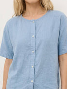 100% cotton two-piece set with button-front top and wide-leg pants in soft colors