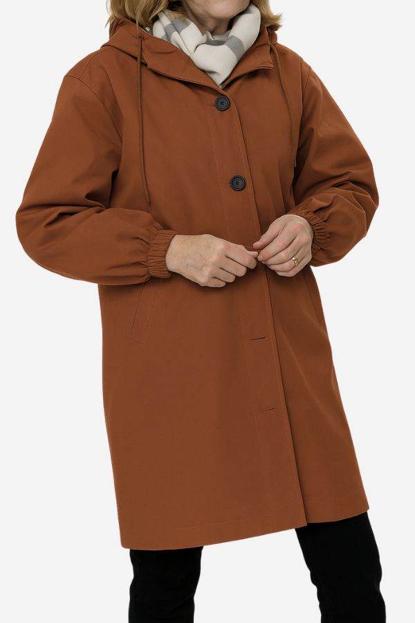 Water resistant oversized hooded brown windbreaker rain jacket with button closure and elastic cuffs