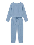 woman wearing cotton-linen monochrome relaxed longline top and wide-leg pants capsule outfit