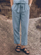 Woman wearing cotton-linen monochrome relaxed longline top and wide-leg pants set
