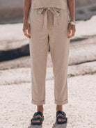 woman wearing cotton-linen monochrome relaxed longline top and wide-leg pants set