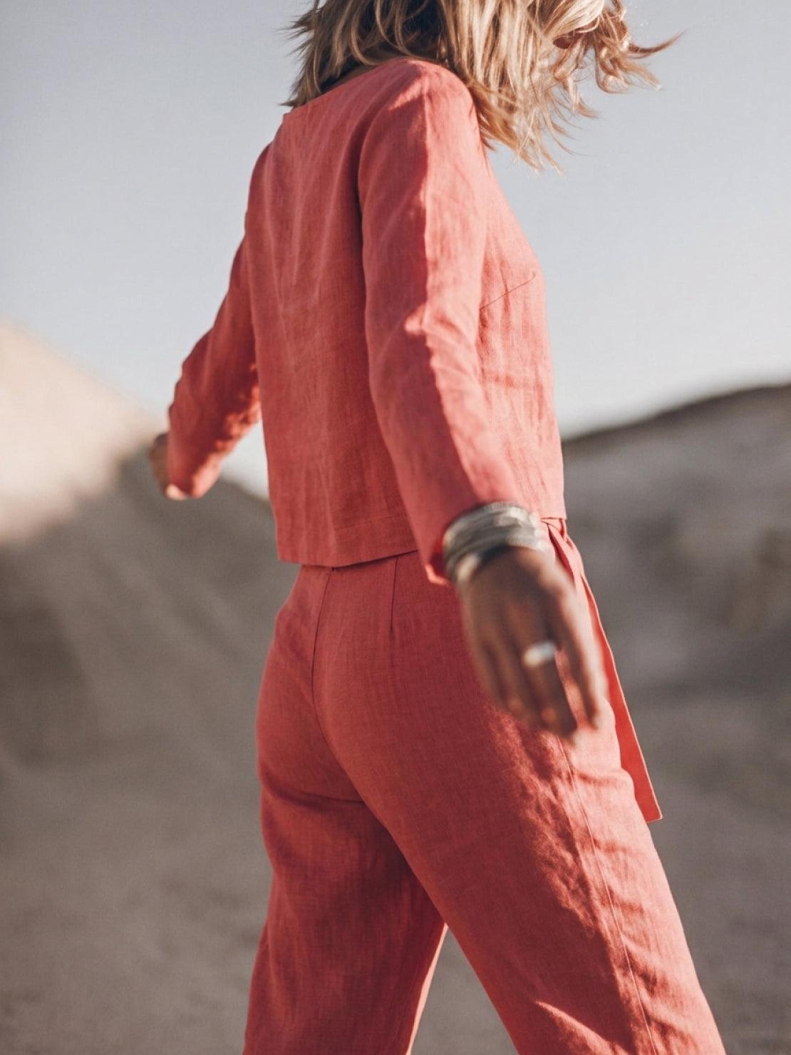 Woman wearing relaxed cotton-linen monochrome capsule outfit with longline top and wide-leg pants