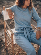 Woman wearing a cotton-linen monochrome relaxed longline top and wide-leg pants set