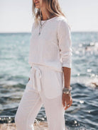 Woman wearing cotton-linen monochrome relaxed longline top and wide-leg pants set