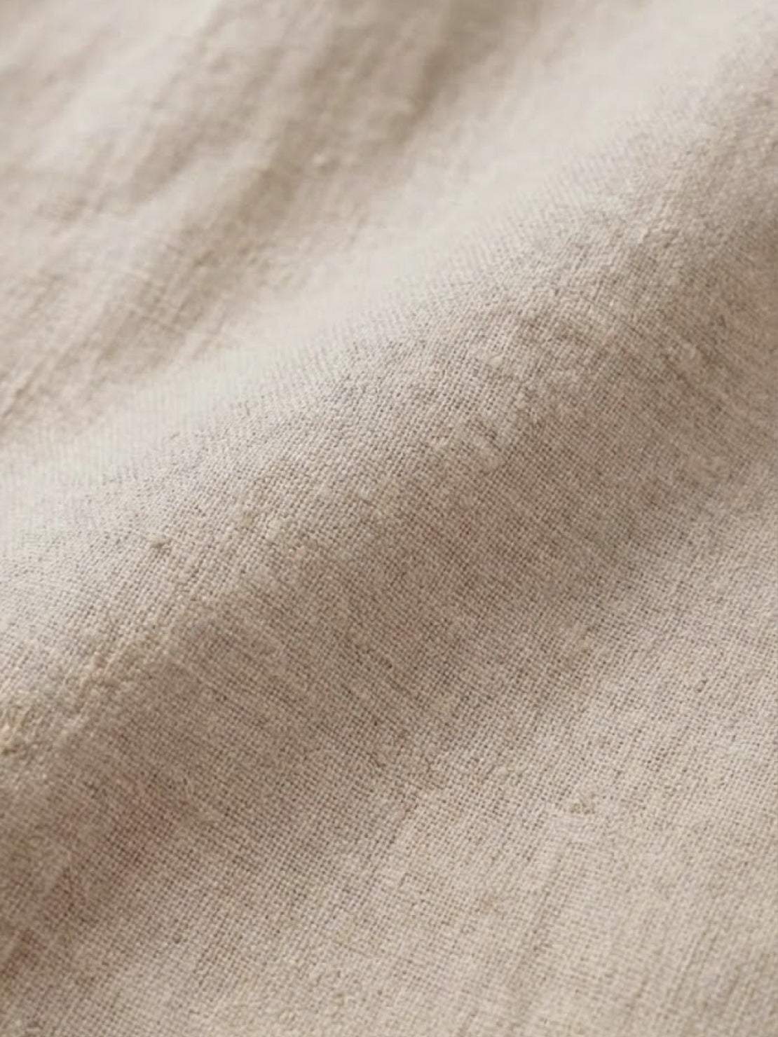 Close-up of soft, breathable pure linen fabric for age-defying shirt