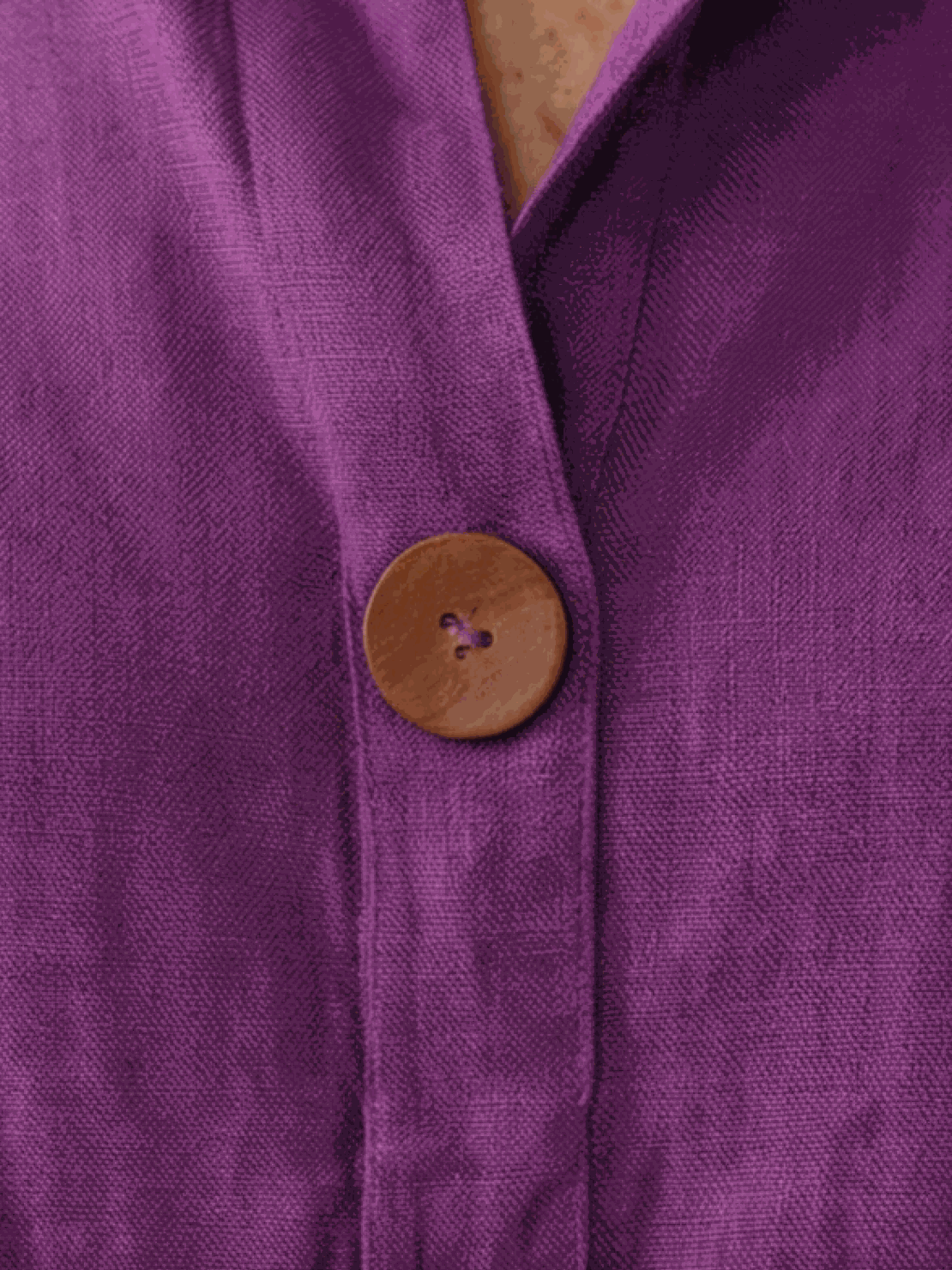 white pure linen age-defying shirt with button details on hanger