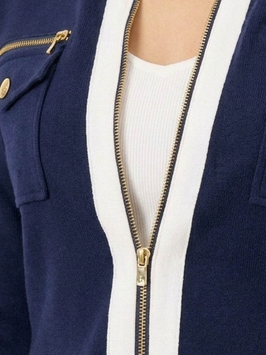 Woman wearing sleek contrast zip two-piece outfit with soft stretch fabric and flattering silhouette