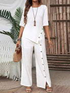 Woman wearing Asymmetry Flow Co-ord set with button-front top and flowing asymmetrical hem pants in soft fabric