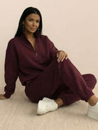 Cotton-blended two-piece tracksuit with high collar and deep zipper, styled for casual comfort and polished look.