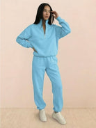 women wearing cotton-blended two-piece tracksuit with high collar and zipper in casual athleisure style