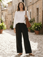 Two women wearing breathable casual chic duo cotton and linen two-piece sets outdoors