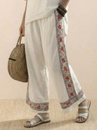 Coastal Comfort Linen two-piece set with lace details and breathable fabric on model by the sea