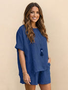 Woman wearing a comfy linen-like shirt and shorts two-piece set in light fabric for casual and versatile style