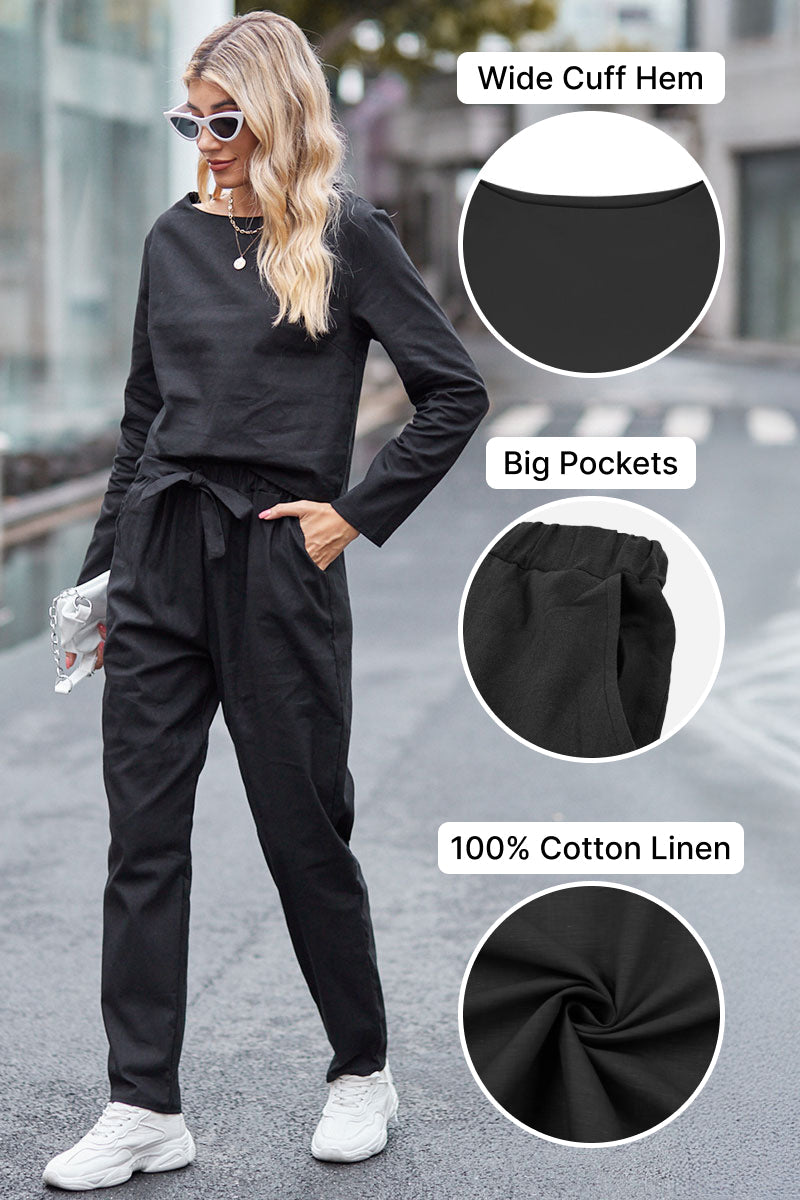 Woman wearing black cotton-linen monochrome relaxed longline top and fluid wide-leg pants with wide cuff hem and big pockets