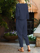 Woman wearing cotton-linen monochrome relaxed longline top and wide-leg pants set