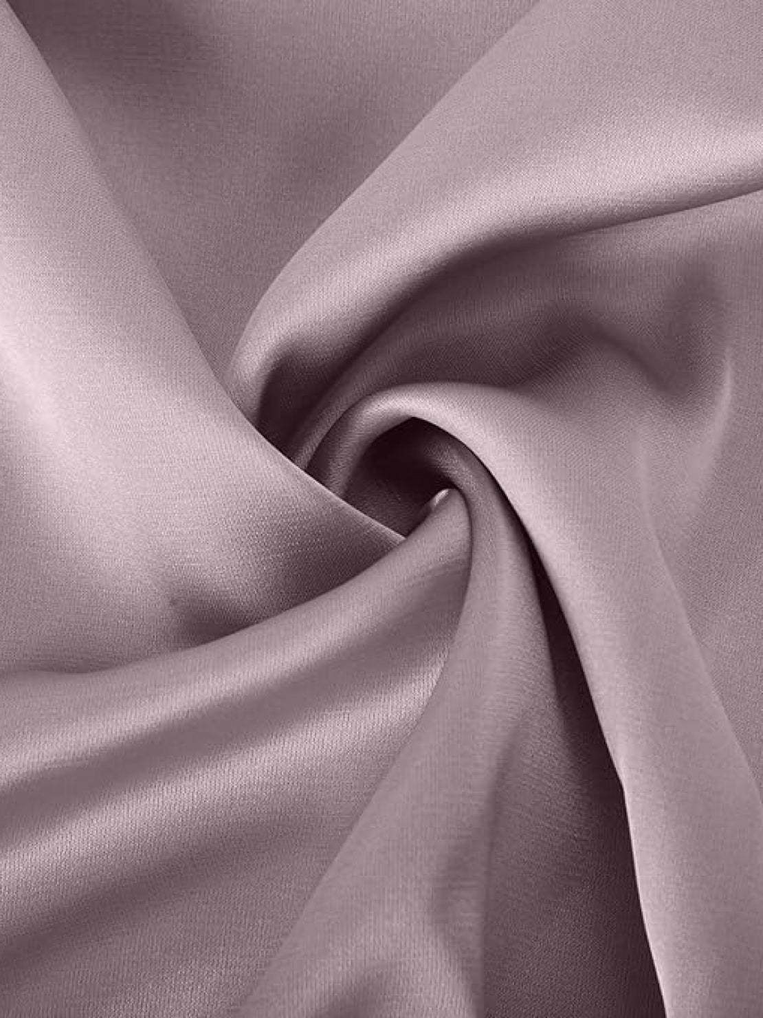 Woman wearing Elegant Layers Two-Piece Set with layered V-neck top and matching pants in soft fabric