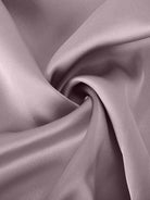 Woman wearing Elegant Layers Two-Piece Set with layered V-neck top and matching pants in soft fabric