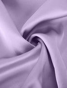 woman wearing Elegant Layers Two-Piece Set with layered V-neck top and matching pants in soft fabric