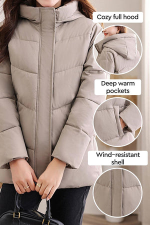 Everyday Warmth Coat mid-length hooded coat with 5-layer thermal insulation, wind-resistant shell, full hood, and deep warm pockets.