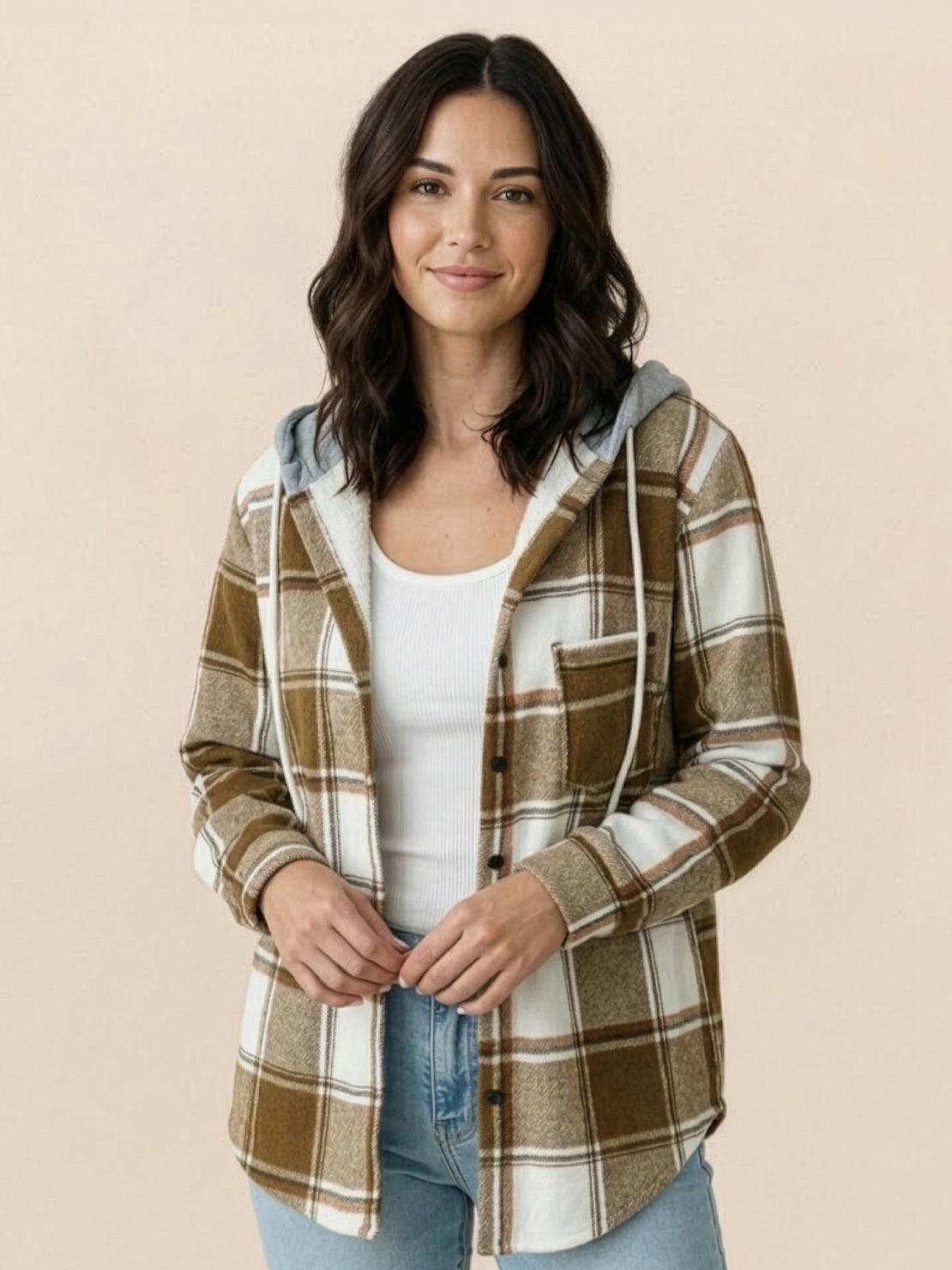 Highland Plaid Shacket with relaxed fit, attached hood, soft fleece lining, and button-front closure in classic plaid pattern