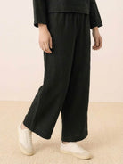 Loose solid color black wide-leg pants in breathable cotton blend fabric