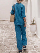 Woman wearing an oversized 100% cotton shirt and wide-leg pants co-ord set in a relaxed, breathable fit