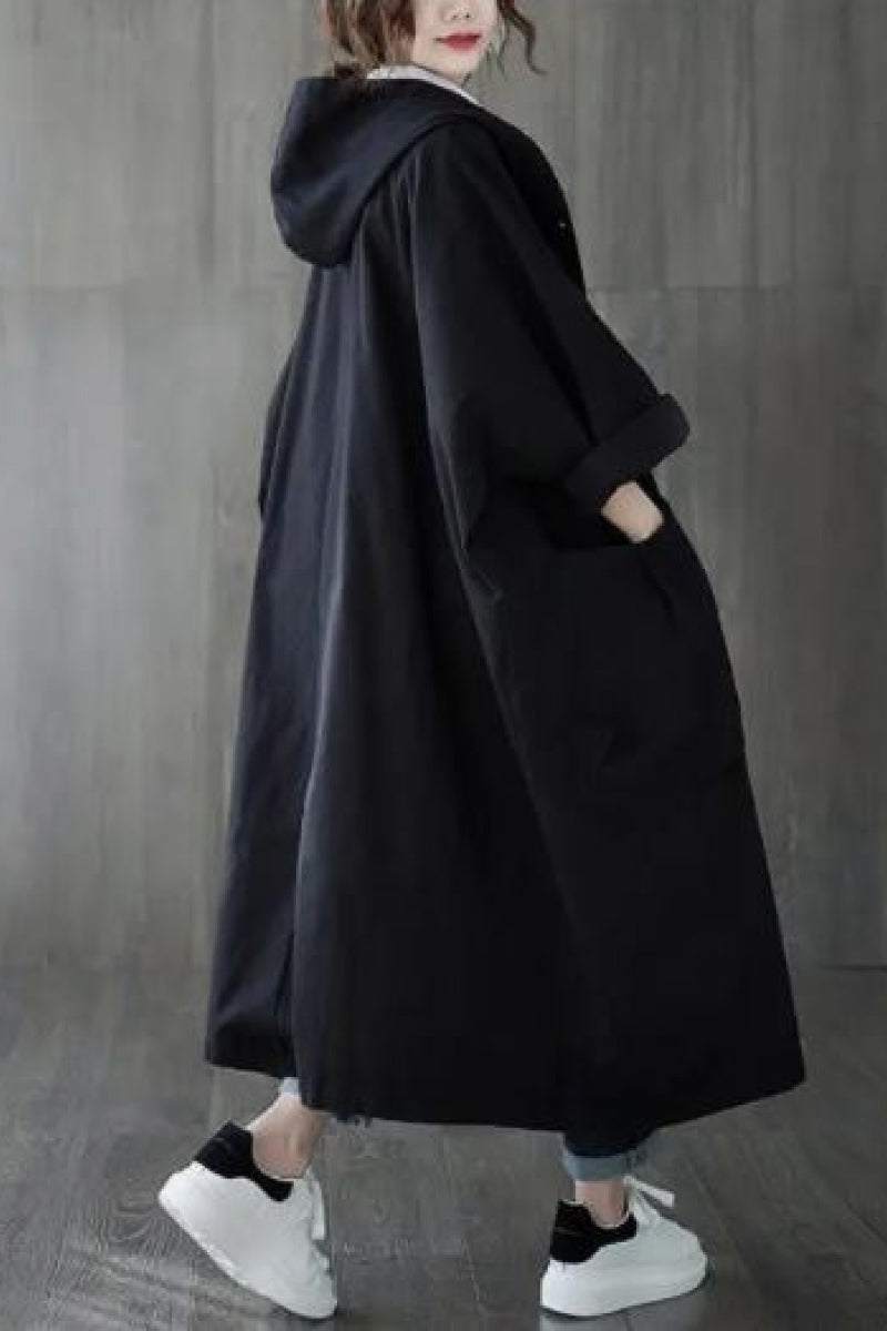 Oversized black Heritage Windbreaker Jacket with hood and large pockets, lightweight and water-resistant for all-season wear