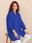 Oversized linen shirt with breathable cotton blend and relaxed fit showcasing back gathers and buttons