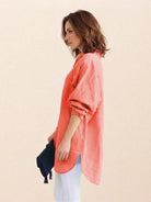 Oversized linen shirt in breathable cotton blend with relaxed fit and back button details