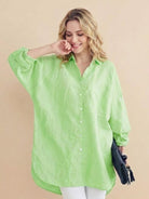 Oversized linen shirt with relaxed fit, back button detail, and breathable cotton-linen blend fabric