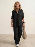 Woman wearing oversized 100% cotton shirt and wide-leg pants co-ord set in a relaxed, breathable fit