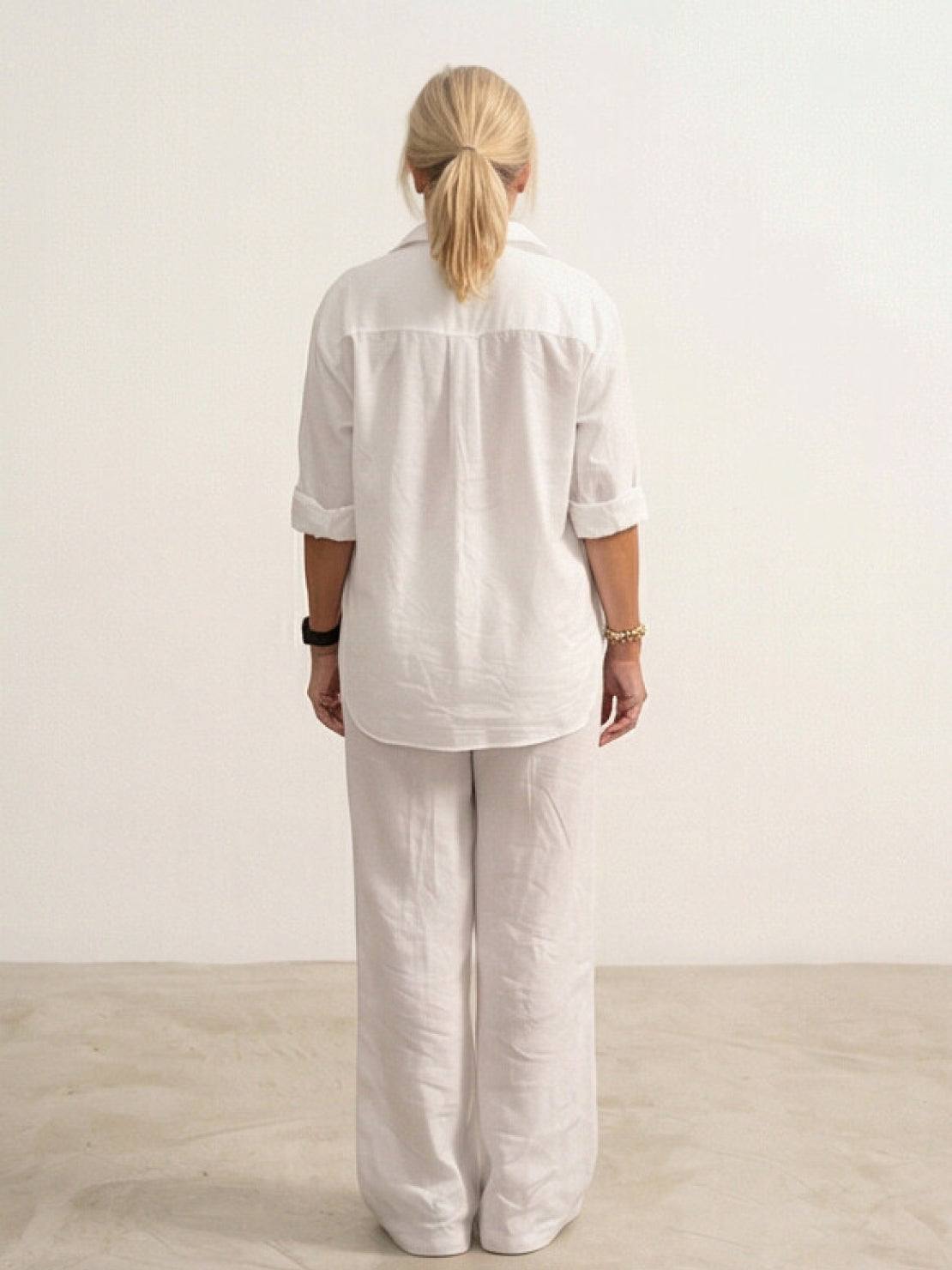 Woman wearing oversized 100% cotton shirt and wide-leg pants co-ord set