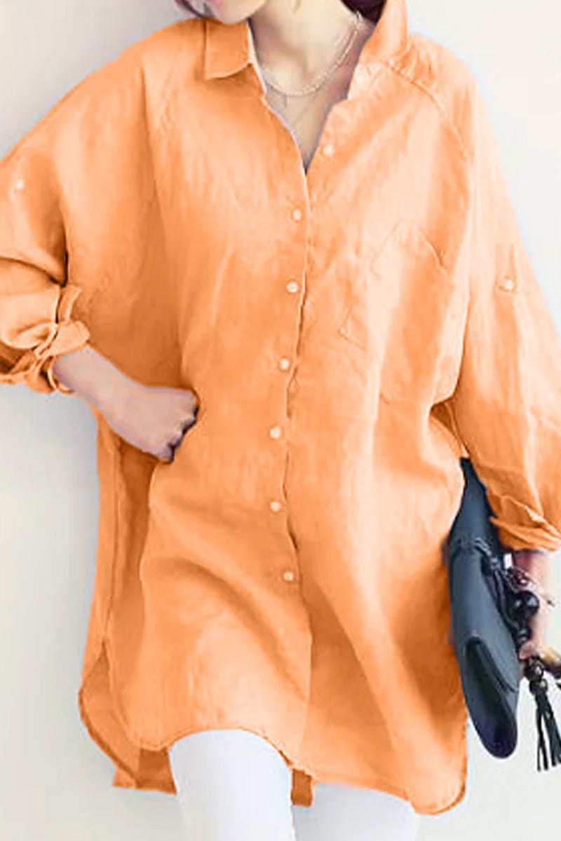 Oversized orange linen shirt with long sleeves and front pocket, styled casual and loose fit