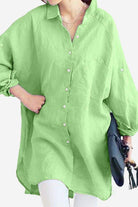Green oversized linen shirt with long sleeves and button-up front in a casual chic style