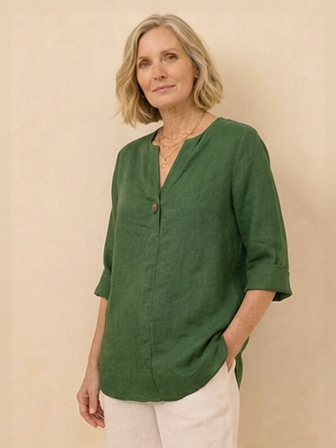 woman wearing pure linen age-defying button detail shirt in coral color