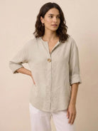 white pure linen age-defying shirt with button detail on hanger