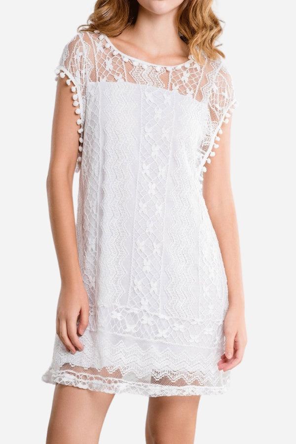 White pom pom lace mini dress with sheer shoulder panel and sleeveless design