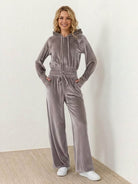 Stylish cropeed velour tracksuit set with hoodie and high-waist pants in plush polyester fabric