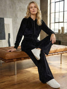 Modern cropped velour tracksuit set with high-waist pants and plush texture in vibrant color