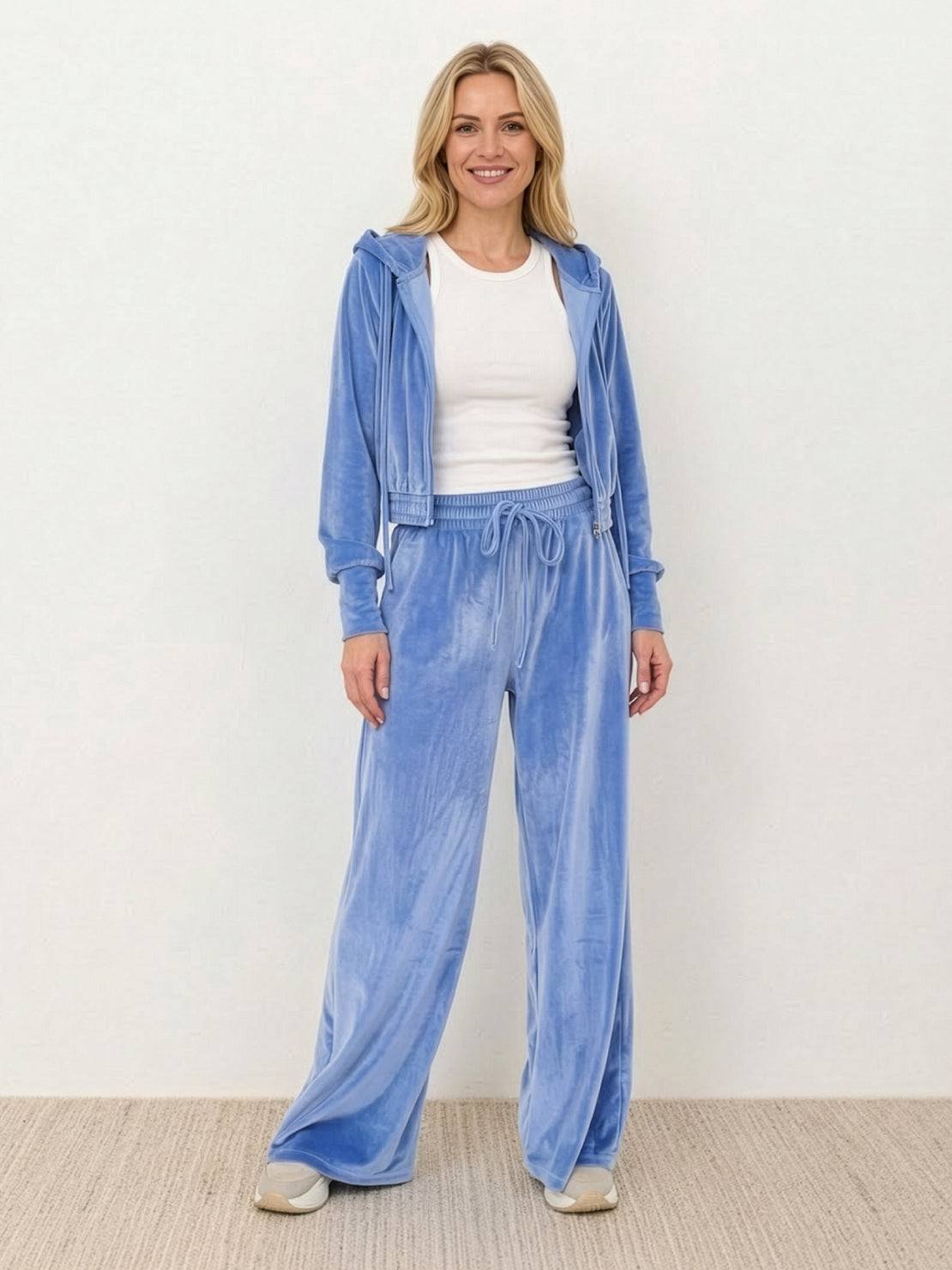 Modern cropped velour tracksuit with high-waist pants in vibrant color and plush texture