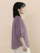 Relaxed loose breathable linen blouse in soft purple with 3/4 sleeves and button-down front